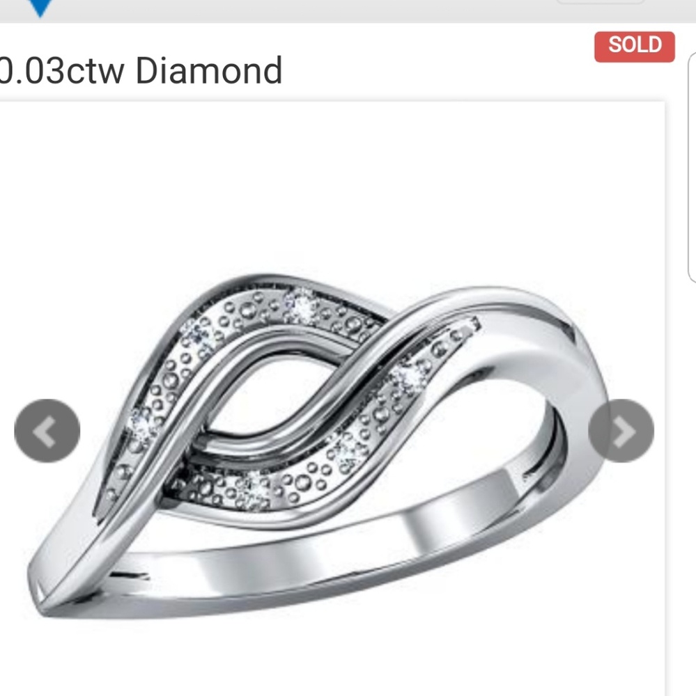 Beautiful rhodium diamond ctw.030 ring size 7